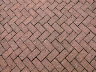  Sidewalk paved with brown tiles   