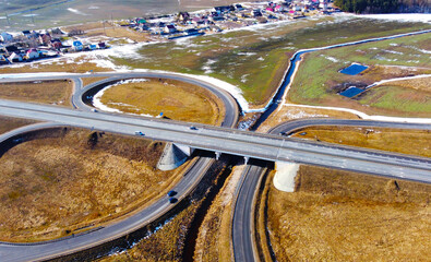 Aerial view of the highway road roundabout. Automobile asphalt circular turn