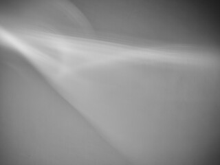 Gray surface texture with abstract beam of light