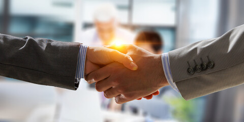 Partnership concept. Image of handshake