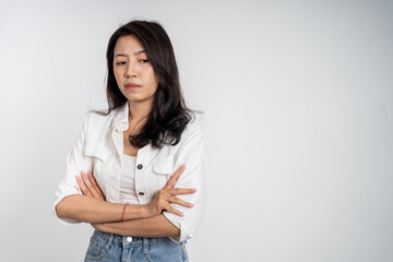 sad portrait of young asian woman over isolated background