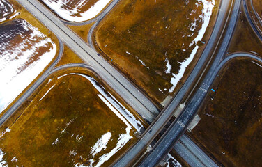 Aerial view of the highway road roundabout. Automobile asphalt circular turn