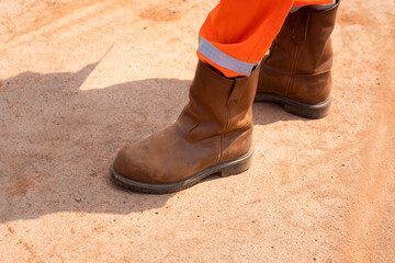 A part of operation staff which is wearied fully PPE such as leather safety shoe and cover. Ready...