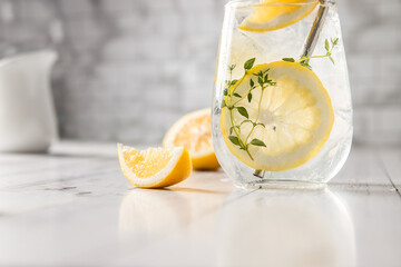 fresh home made lemon lemonade served for refreshment on white wooden table, copy space, healthy...