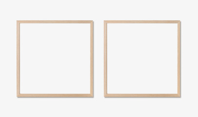 Picture frame mockup. Set of two square oak wooden frames on white wall. Template for artwork,...