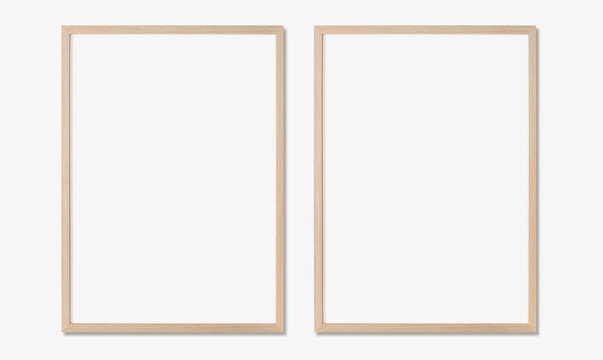 Picture frame mockup, Set of two vertical oak wooden frames on white wall, Template for artwork, painting or poster
