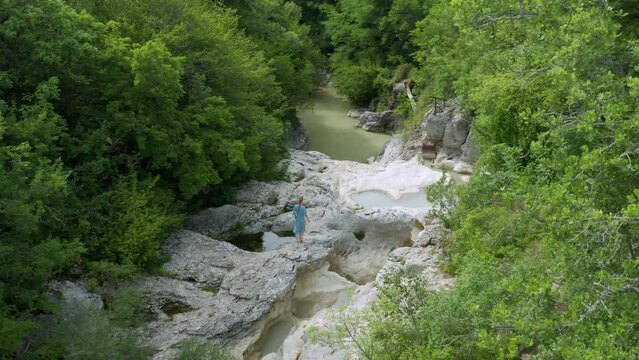 Female Tourist Walking On Rock At Mirna River In Kotli, Istria, Croatia. aerial