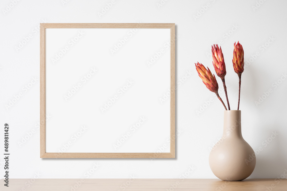 Wall mural blank picture frame mockup on white wall, template for square artwork. view of modern minimal style 