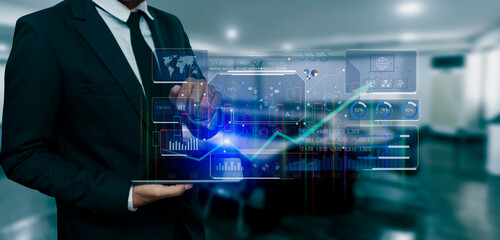 Fototapeta na wymiar Businessman hands touching on business financial and investment data graph, Digital market concept.