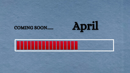 Top view of loading bar with text - Coming soon April. Light blue background.