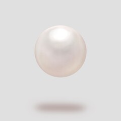 グレー背景の宙に浮いた真珠