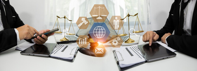 Concepts of Law and Legal services. Lawyer working with law interface icons. Blurred background.	