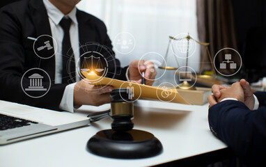 Concepts of Law and Legal services. Lawyer working with law interface icons. Blurred background.	