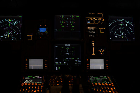 Illuminated speedometers on illuminated control panel in cockpit