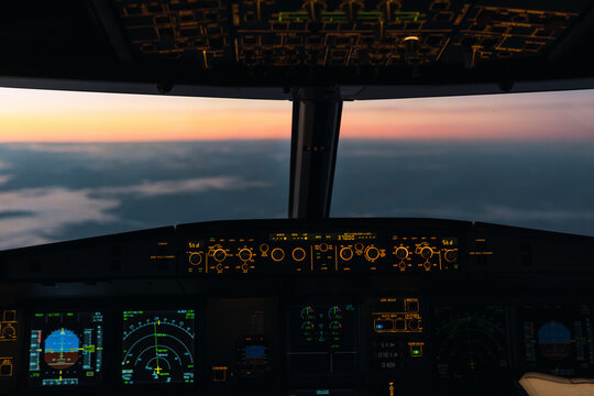 Idyllic sunset seen through illuminated cockpit