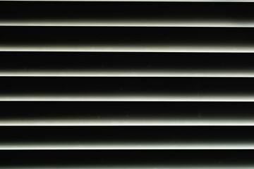 Blinds in the night window.