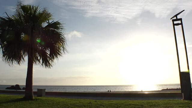 CHTAN-CHO, OKINAWA, JAPAN - AUG 2021 : View of Araha beach (Ocean or sea) in sunset time. Wide view, long time lapse shot, dusk to night. Summer holiday, vacation and resort concept shot.