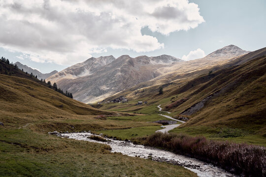 River flowing in stream amidst mountains, Foscagno Pass, Valtellina, Bormio, Italy