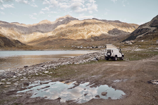 Motor home by lake and mountains, Splugen Pass, Sondrio, Italy