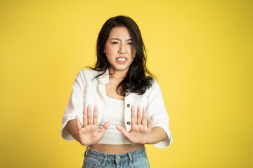 Young woman refusing with both palms gesture