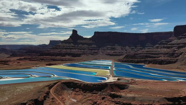 Aerial View Of Potash Mine And Evaporation Ponds In The Desert Of Moab, Utah, USA - drone shot