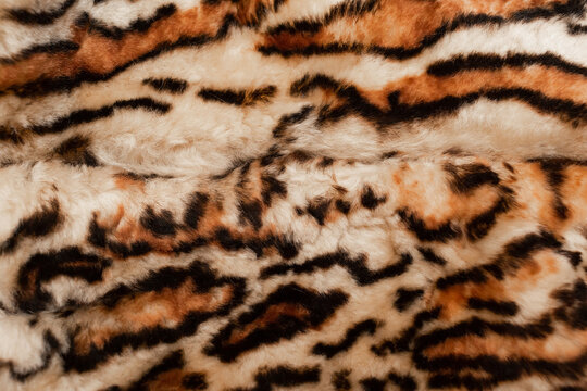 Faux fur, tiger color. Vintage material. The texture of the fur.