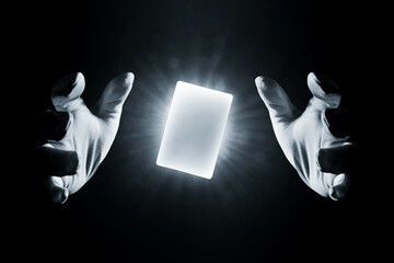 Magician hands showing magic trick isolated on black background - 489820876