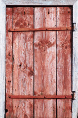 Texture of old wooden door made of planks covered with paint