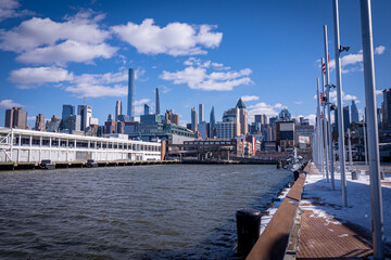 View of a pier on the west side of Hell's Kitchen in Manhattan, New York City, USA, on a freezing cold but sunny winter day