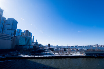 View of a pier on the west side of Hell's Kitchen in Manhattan, New York City, USA, on a freezing cold but sunny winter day