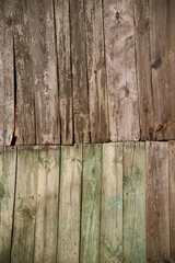 Texture of old wooden door or fence made of planks covered with paint