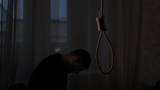 Depressed man contemplating suicide