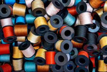 cotton sewing thread spool background, top view