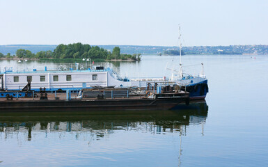 Fototapeta premium KAZAN, RUSSIA - July 7, 2021. Main passenger terminal in the river port of Kazan on the Volga river. Passenger ship moored in front of terminal. City of Kazan, Republic of Tatarstan, Russia.