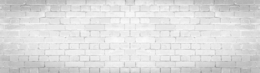 White gray light damaged rustic brick wall brickwork stonework masonry texture background banner...