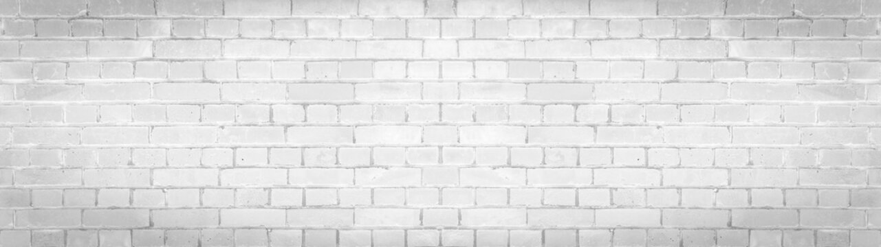 White gray light damaged rustic brick wall brickwork stonework masonry texture background banner panorama pattern template architecture..