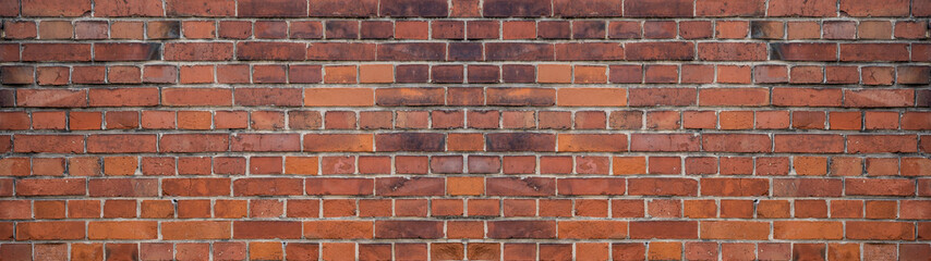 Orange red brown damaged rustic brick wall brickwork stonework masonry texture background banner panorama pattern template architecture..