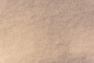 Snow and morning light on the field.