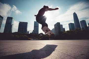 Skateboarder skateboarding outdoors in city © lzf