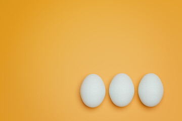 Three white chicken eggs on yellow background top view. Creative food minimalistic background.