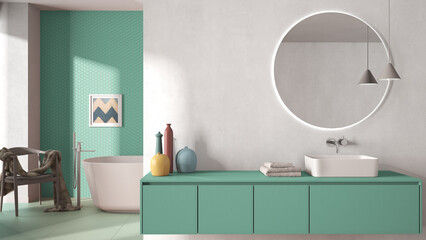 Cozy minimalist bathroom in blue pastel tones, washbasin with mirror, bathtub, tiles and concrete walls, armchair, colored vases and decors, interior design project concept idea