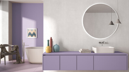 Cozy minimalist bathroom in purple pastel tones, washbasin with mirror, bathtub, tiles and concrete walls, armchair, colored vases and decors, interior design project concept idea
