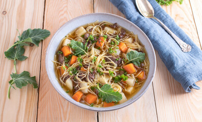 Beef noodle soup isolated on wooden table