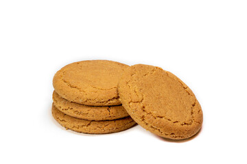 A stack of crunchy ginger cookies placed on a white background.