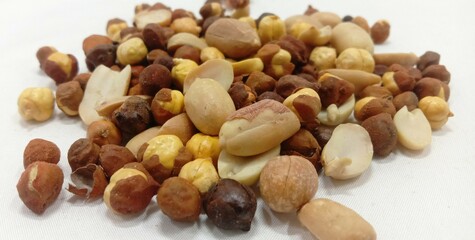 Peanut And Hazelnut Both On White Background