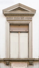 Fototapeta premium facade with typical windows with ornament, ancient 18th century Italian palace in Como, Italy.