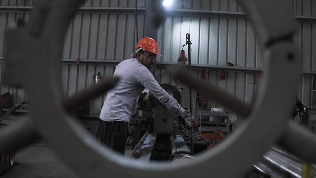 India metallurgic factory production line, tired working class manpower during night shift working hard on the production manufactory line