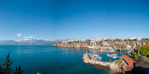 View of Antalya Old City Harbor, the Taurus Mountains and the spelling of the Mediterranean Sea