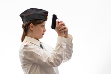 A beautiful young woman Russian police officer lieutenant colonel in dress uniform in a cap with a...