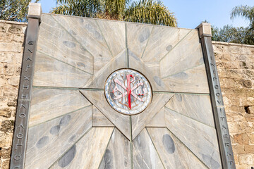 Religious symbol on the wall in the yard of the Church Of Annunciation in Nazareth, northern Israel